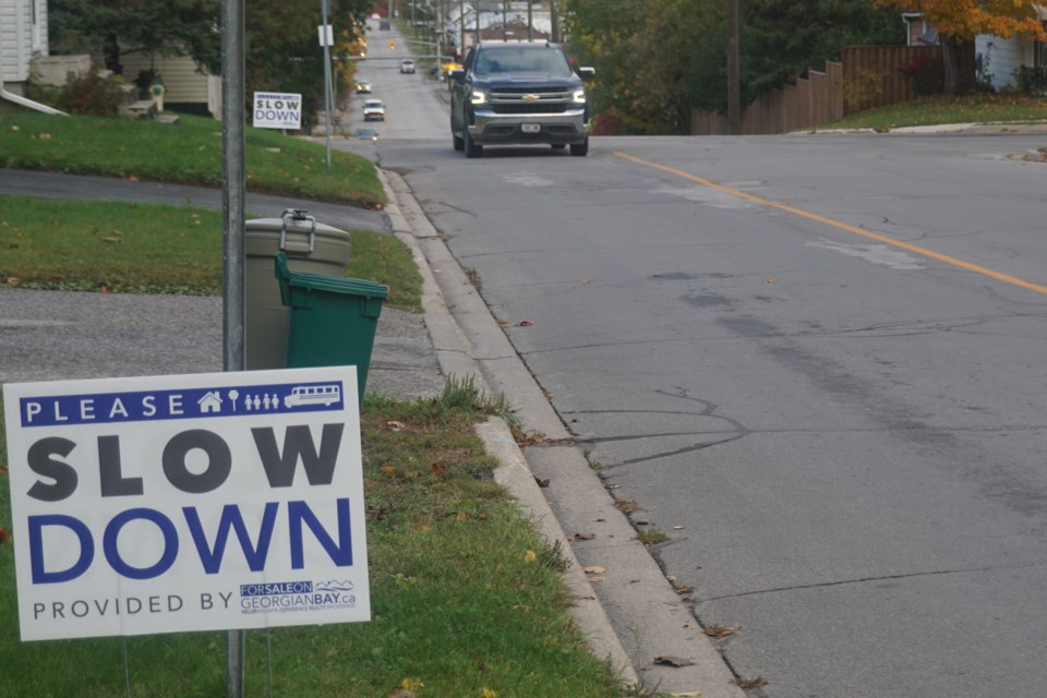 Signs urging drivers to slow down have become a common sight throughout the region, including on Fourth Street.