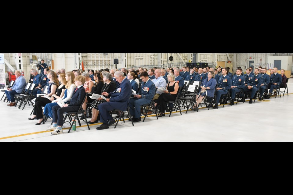 Nearly 100 people packed a hangar at 15 Wing Airbase for the change of command ceremony. Photo by Jason G. Antonio