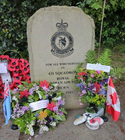 Flowers can been seen at the 431 Squadron memorial in the village of Burn in the United Kingdom