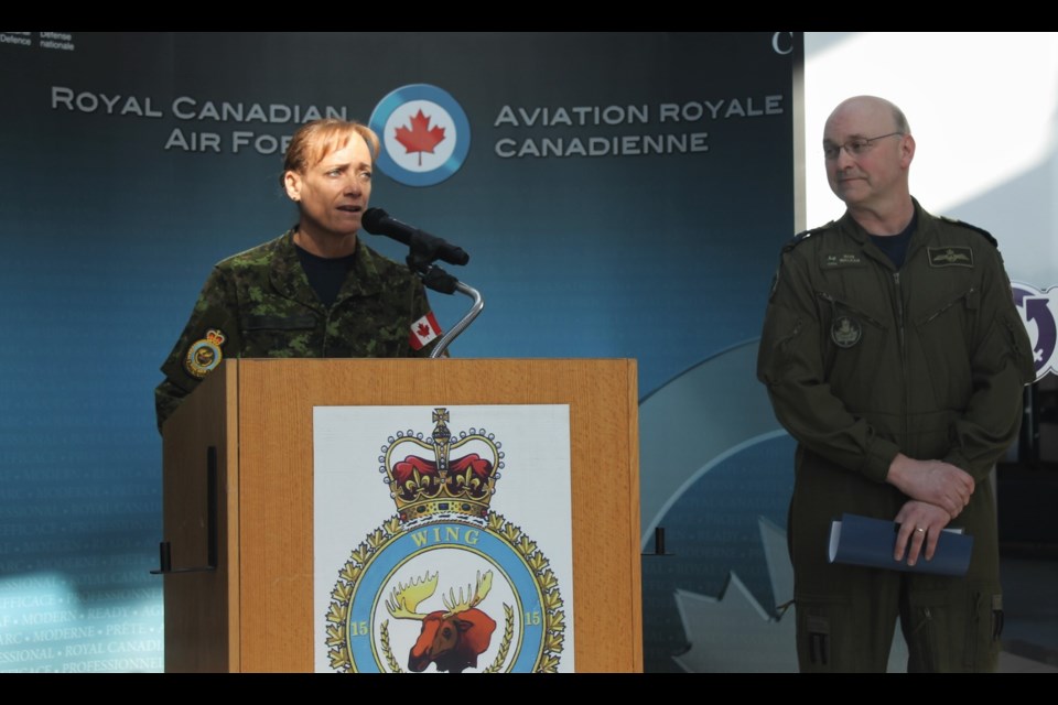 15 Wing Moose Jaw Chief Warrant Officer Marlene Shillingford (L) took the podium for opening comments at the International Women’s Day workshop on base, following comments from Wing Commander Col. Ron Walker (R). 