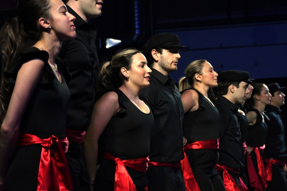 A lineup of traditional Greek dancers gets ready for their next traditional performance at Greek Night 2025.