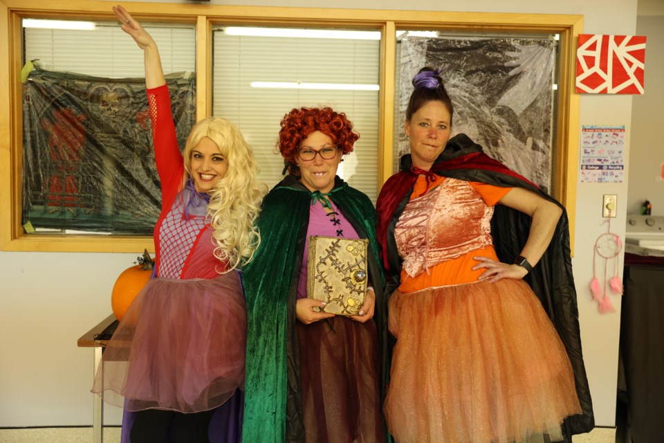 Volunteers for the event, (l-r) Andrea Montgomery, Darci Dessert, and Tricia Broomfield all dressed up for the fun and festivities. 