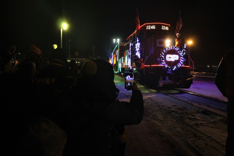 The crowd was suitably excited to see those bright colourful lights pulling into the train yard, as the CP Holiday Train arrived in Moose Jaw. 