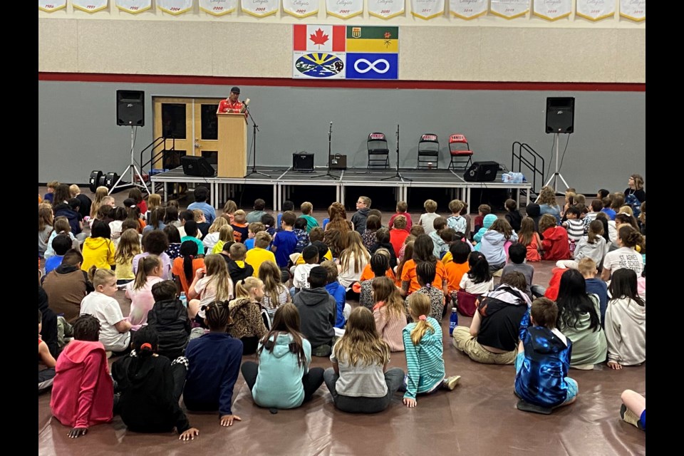 Knowledge keeper Lyndon Linklater sings a song about kindness for Holy Trinity Catholic School Division students on National Indigenous Peoples' Day