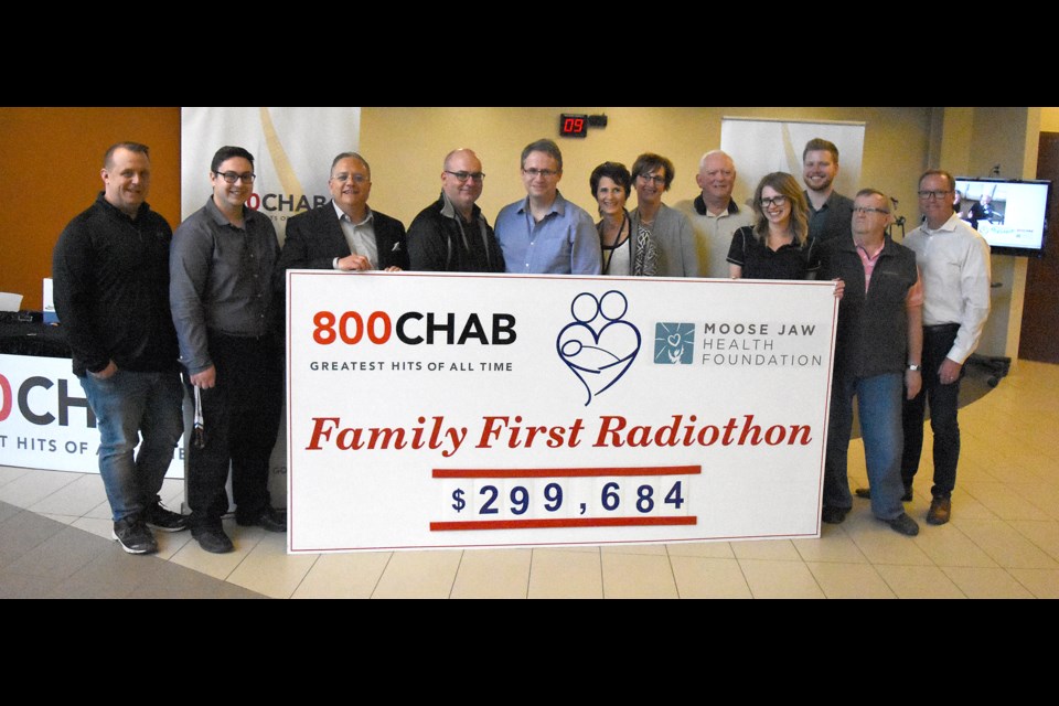 Members of 8oo CHAB and the Moose Jaw Health Foundation gather with the cheque for the final total from the Family First Radiothon.
