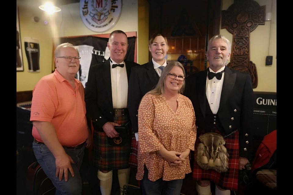 Kevin Haakenson (left) is the co-owner of Bobby's Place; Andrew Gallagher delivered the address; Michelle Carline (back row) was the piper; Monica Haakenson (front row) is the co-owner of Bobby's Place and replied to the toast to the lassies; Tom Green (right) delivered the toast to the lassies.