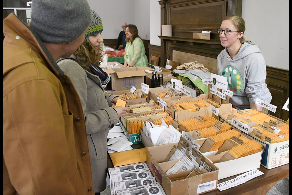 Seedy Sunday patrons check out offerings from Prairie Garden Seeds.