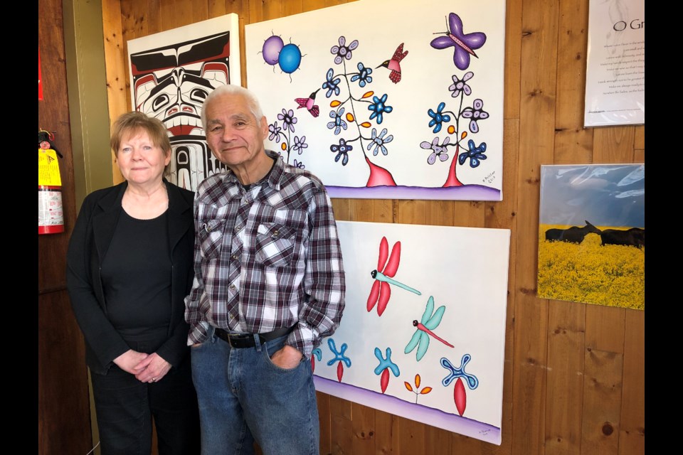 Caron and Dave Pelletier have decided to close Moosgaw Arts and Gifts so they can focus more on her family and his full-time job at 15 Wing Moose Jaw. Their business sells artwork and paintings that local Aboriginal and non-Aboriginal artists have created. To Dave's left are two paintings that he recently created. Photo by Jason G. Antonio