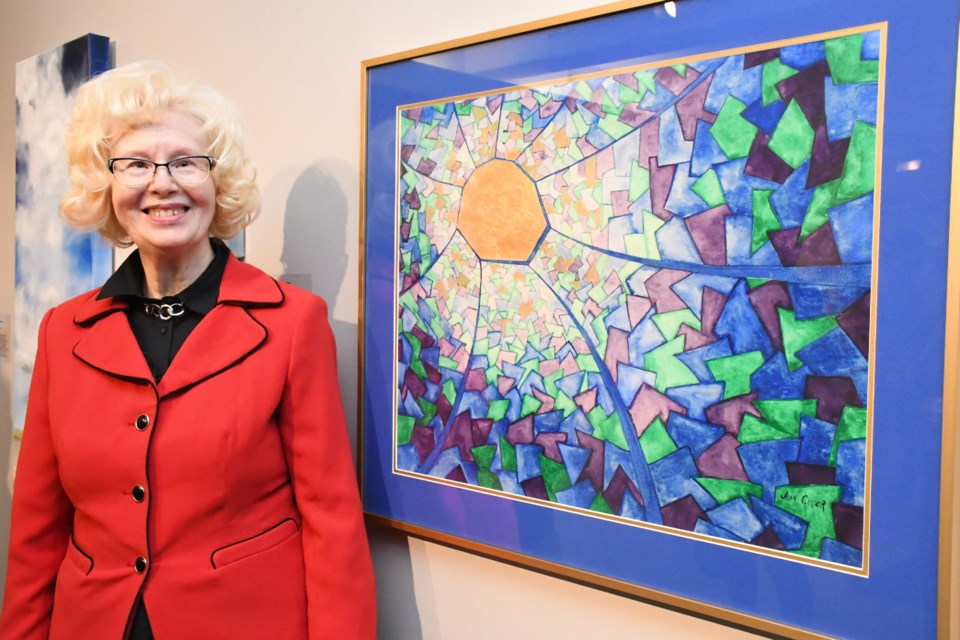 Jean Crozier speaks about the piece she created, called Stain Glass Web, which used watercolour, acrylic and tissue paper on matte medium with Bristol board. Photo by Jason G. Antonio