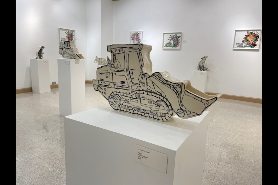 Barbara Goretzky's "Diggers" features multiple artistic medias, but the ceramic machines and animals are the highlight