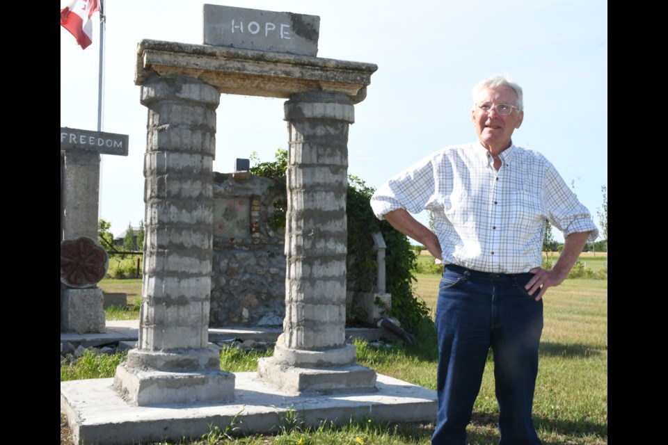 Bailon resident Jerry Kaiser stands in front of the Matriarch that he completed this year to honour the female pioneers of the area. He also completed the Matrons wall monument in the background. Photo by Jason G. Antonio