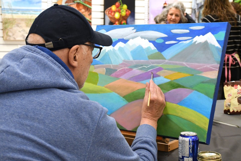 Patrick Hall, president of the Living Sky Art Collective, works on a painting inside the group’s new public studio space at the Town ‘N’ Country Mall. The gallery is open Thursdays to Saturdays for visitors to browse, observe, and connect with local artists.