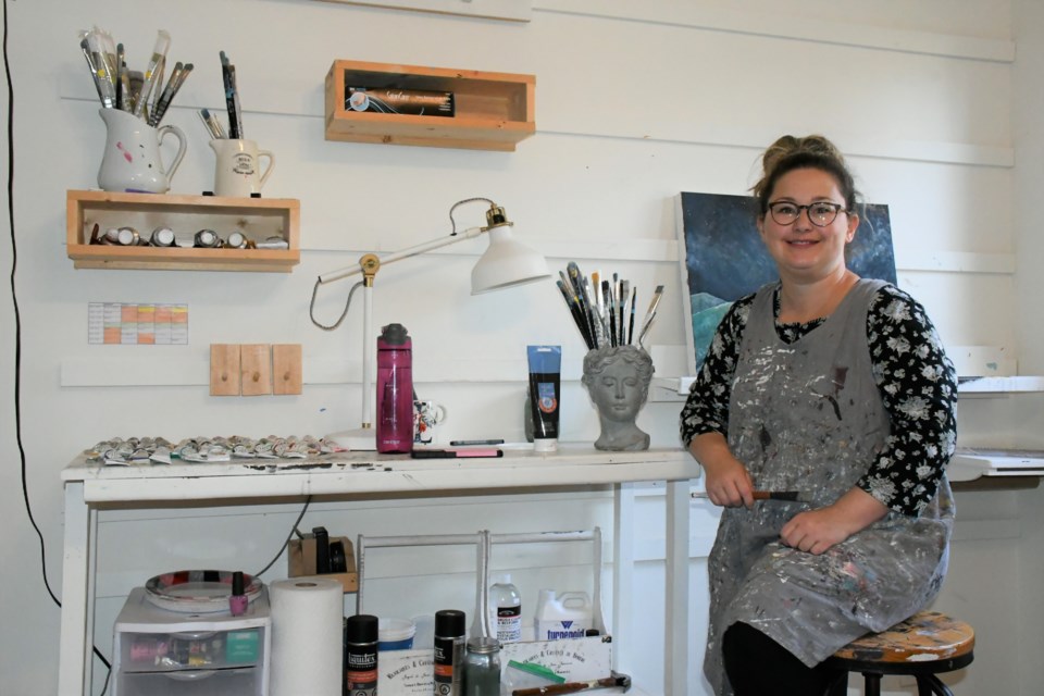 Artist Laura Hamilton in her art studio. Photo by Jason G. Antonio