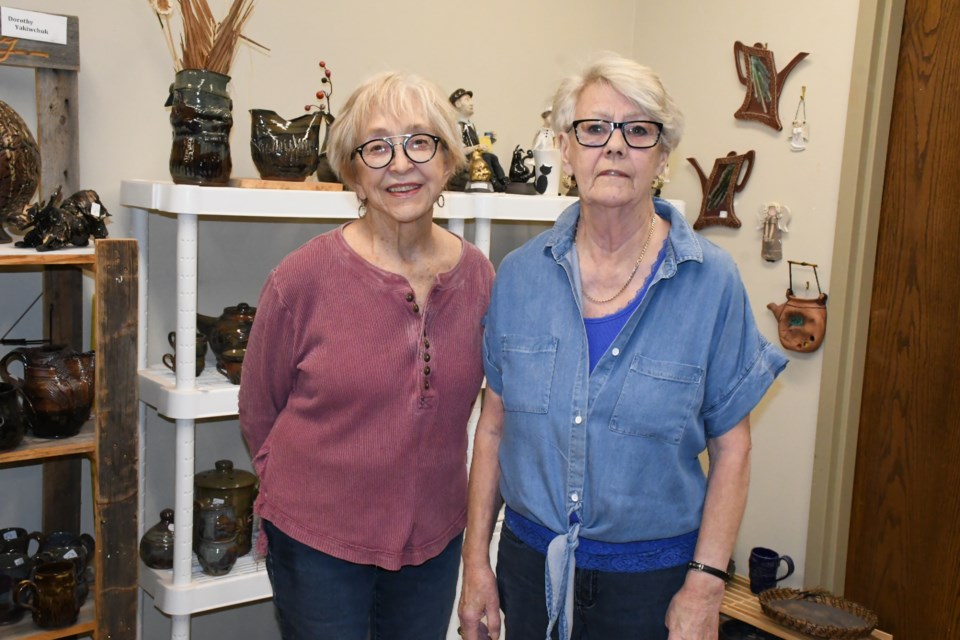 Dorothy Yakiwchuk and Kathy Verbeke make up the pottery group, the Mud Pie Girls. Photo by Jason G. Antonio