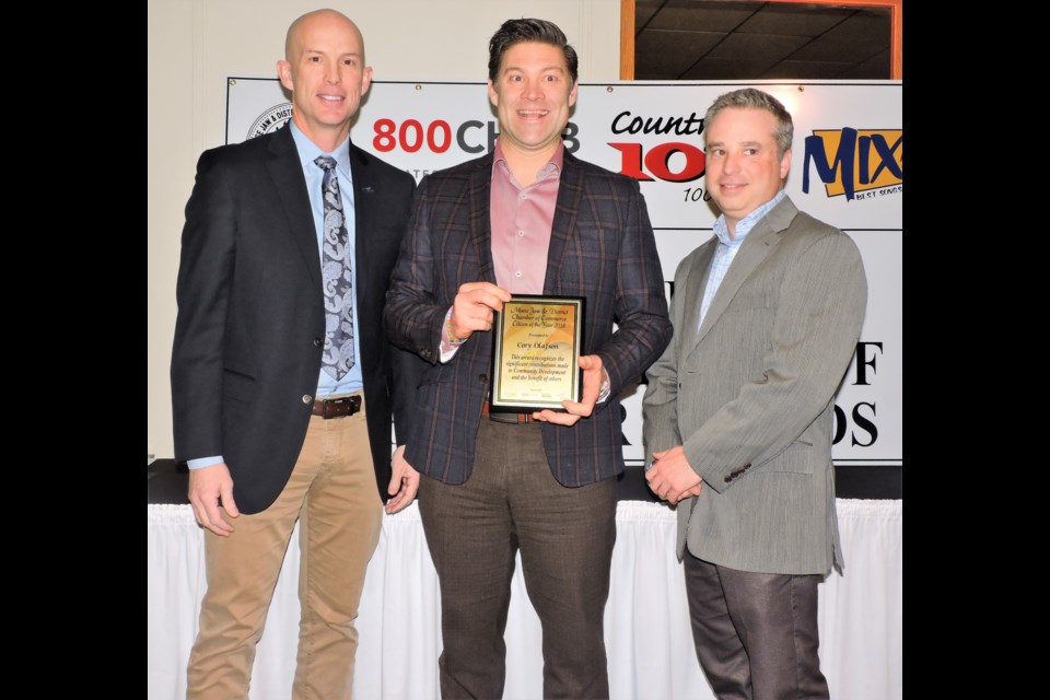 Cory Olafson accepts the Citizen of the Year Award. From left to right: Scott Greenough of CAE, Cory Olafson, and Chamber of Commerce president Riley Wright. Sasha-Gay Lobban photograph