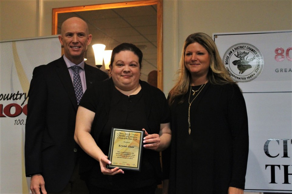 Citizen of the Year Award winner Krystal Chow, with presenters Scott Greenough from CAE Canada Inc. (L) and Chamber of Commerce president Jasmine Cameron (R).