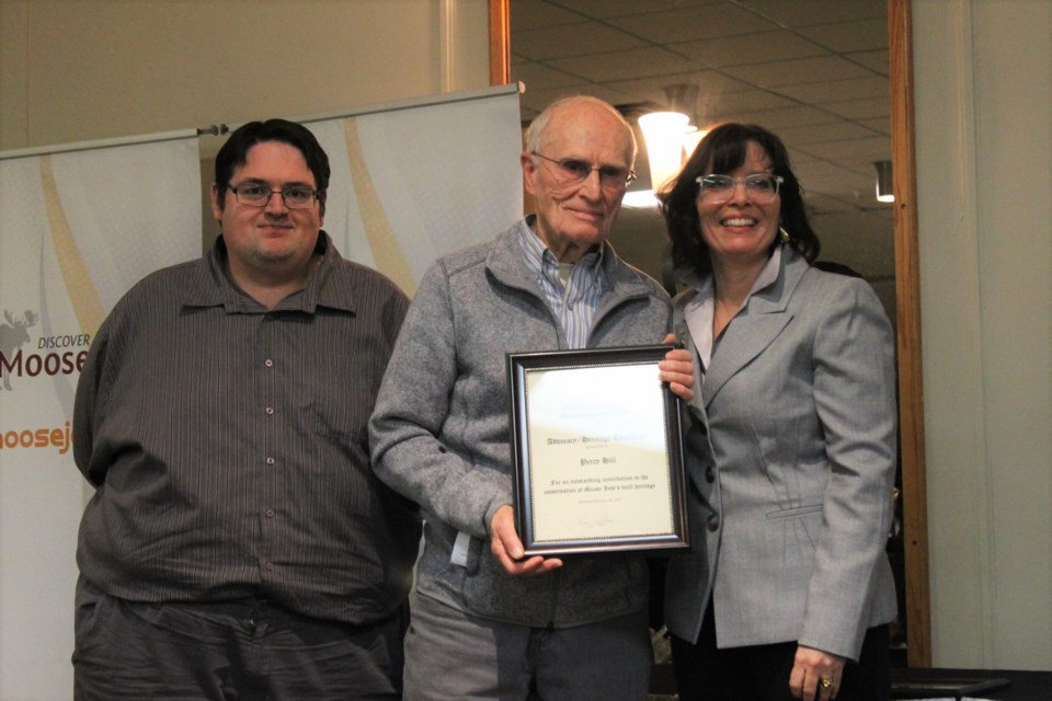 Percy Hill, accepting the Heritage Advocacy & Education Award from Heritage Advisory Committee members Scott Hellings and Crystal Froese.