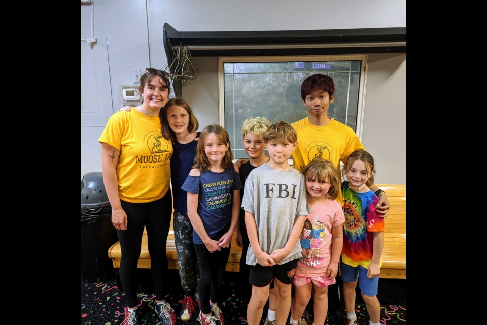 (L-R) Paige Pierce, Arianna, Amelia, Erayeen, Kaiven, Justin Arandia (tall, yellow shirt), Kimberley, and Riya