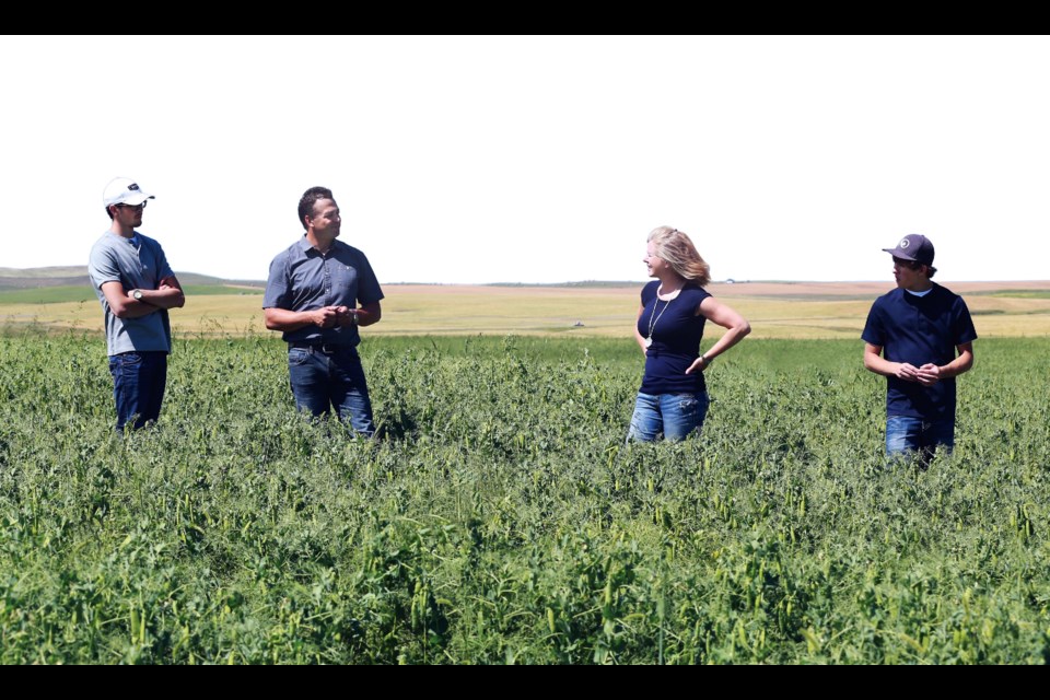 The Zak family: Brody, left, Allen, Marilyn and Cole in their fields near Fir Mountain. (handout photograph)