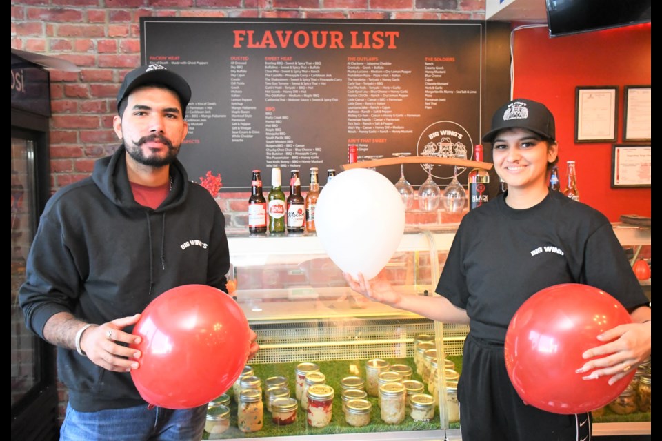 Big Wing's restaurant celebrated its grand opening on Sept. 23 and was packed the first night. Pictured are Gagandeep Ghuman, co-owner of Big Wing's restaurant, and manager Somaya Singh. Photo by Jason G. Antonio 