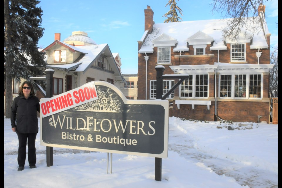 Ellen Watkinson stands outside her business on Langdon Crescent. She hopes that WildFlowers Bistro and Boutique will open Dec. 1. Photo by Jason G. Antonio