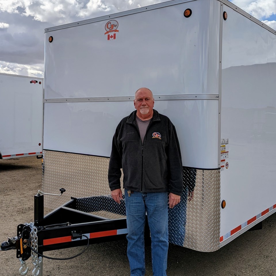 Brad Harvey with one of his company's trailers