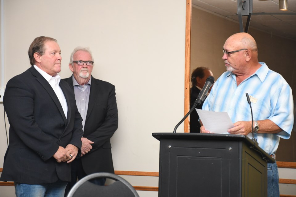 Deputy mayor Doug Blanc (right) swears in Aaron Ruston (left) as new president of the chamber of commerce. Photo by Jason G. Antonio 