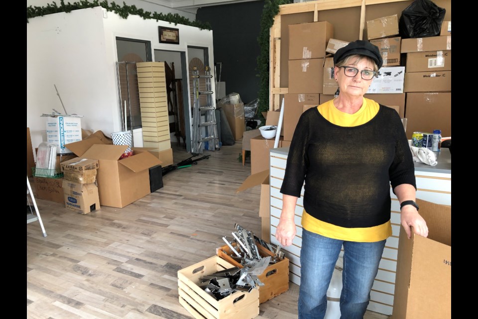 Cher Riendeau stands inside her nearly-empty business on Main Street on Oct. 30. The pandemic is the main reason she shut down Cher’s Beauty Boutique and Body Contouring. Photo by Jason G. Antonio   