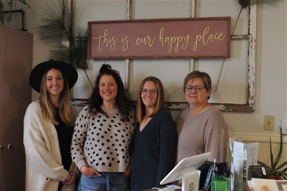 Co-owners Noelle Bossence and Angela Molde of The Farmstand General Store and co-owners Dolores and Lindsey Unger of Painted Brush Creations under the only sign in the store not for sale — because it sums up how they feel about their business.
