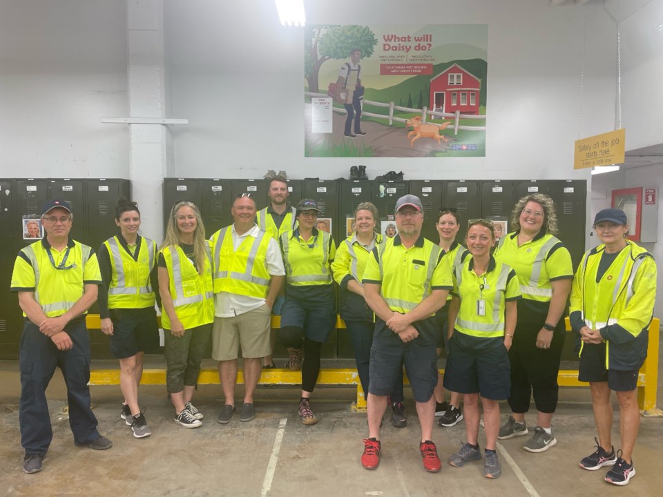 gary-overs-third-from-left-with-white-shirt-and-sunglasses-with-canada-post-moose-jaw-workers