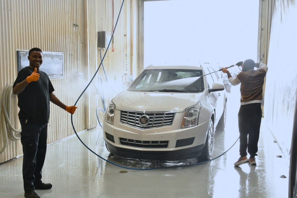 Two volunteers from St. Joseph’s Parish clean a vehicle during the charity car wash held at Moose Jaw Ford on June 14. Proceeds supported the church’s ongoing building restoration campaign.