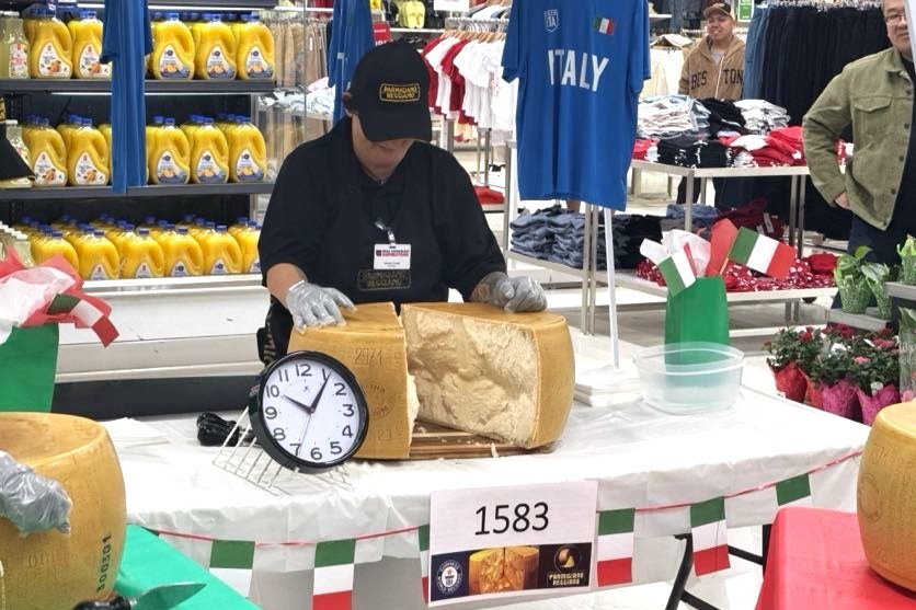 A Real Canadian Superstore employee finishes cracking open a wheel of Parmigiano Reggiano as part of the Guinness World Record attempt.