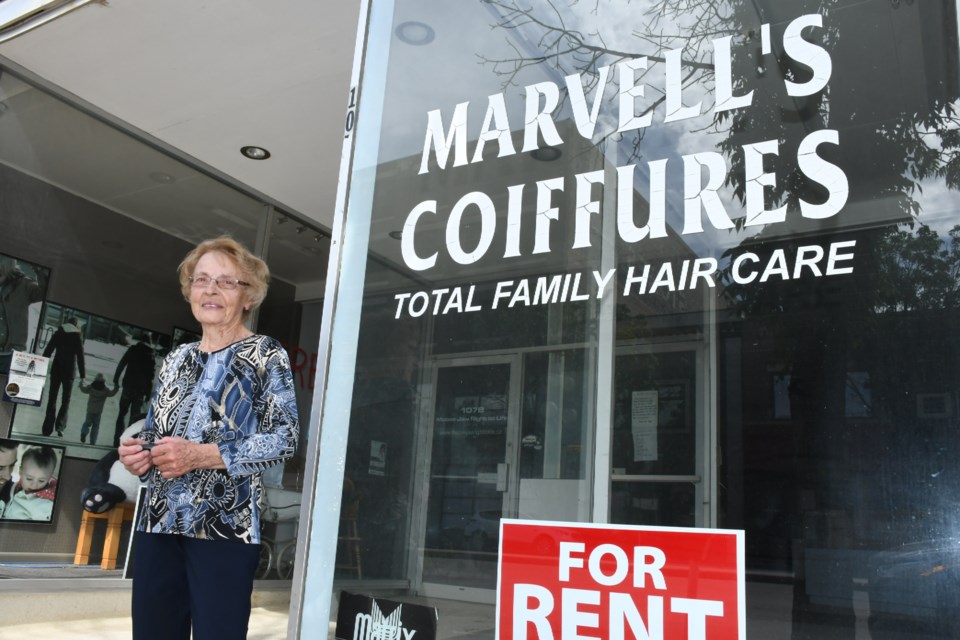 Marvel Coghlin stands in front of her business Marvell’s Coiffures, which she shut down recently after deciding to retire. Coghlin had been a barber since the 1950s. Photo by Jason G. Antonio 