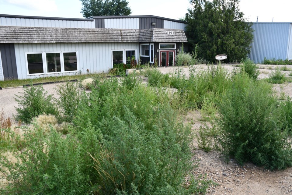 The front of the proposed Scotch distillery has weeds growing on it as of Friday. MJ Independent photo