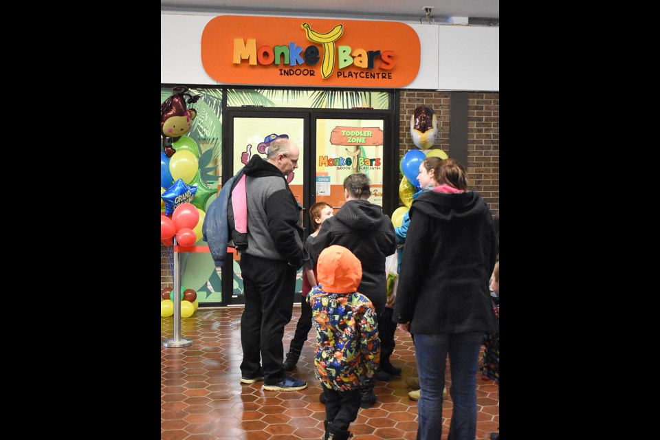 Patrons line up before the opening of Monkey Bars in the Town’n’Country Mall on Saturday morning.