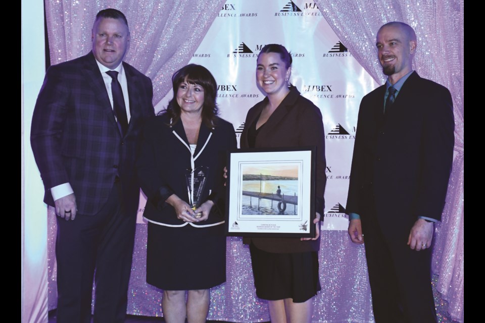 Members of the Boyczuk family, sponsor HK Henderson and the Chamber of Commerce gather for a picture after Christine Boyczuk was named the Business Leader of the Year Award. Photo by Jason G. Antonio