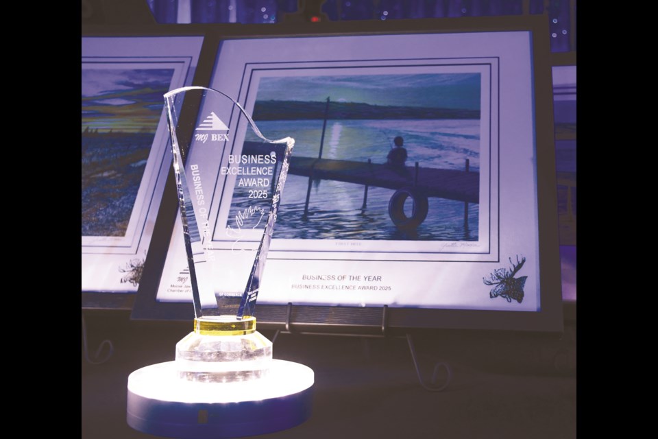 The Business of the Year trophy and accompanying painting. Photo by Jason G. Antonio