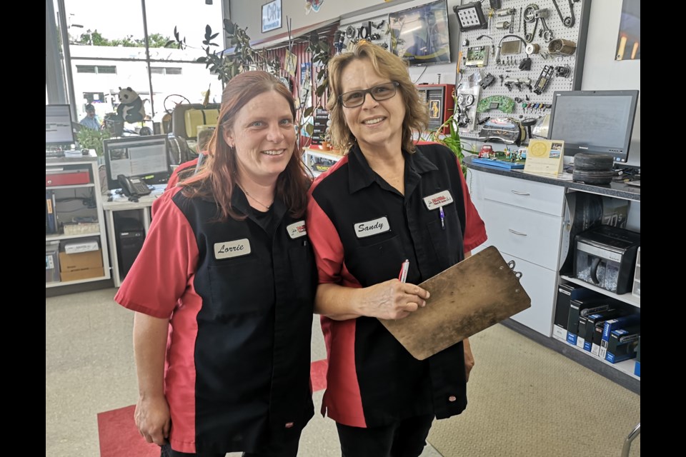 Lorrie Moggey (left) and Sandy Worth, customer service representative at Panda Tire and Auto (right). 