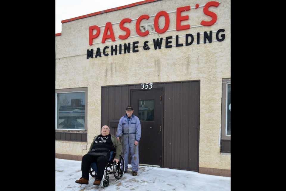 Larry, left, and Ron Ozog pose in front of Pascoe's Machine Works on one of its final days in business. (Matthew Gourlie) 