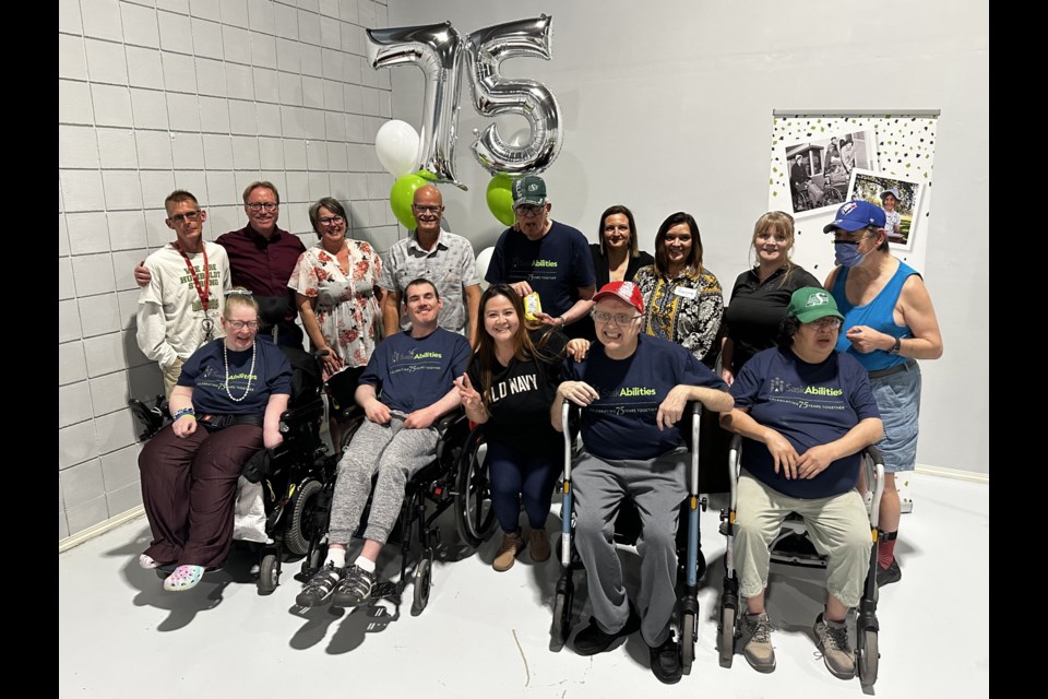 Residents of SaskAbilities’ two Moose Jaw homes are joined by staff, family, and friends during the organization’s 75th anniversary celebration, held at the Western Development Museum.