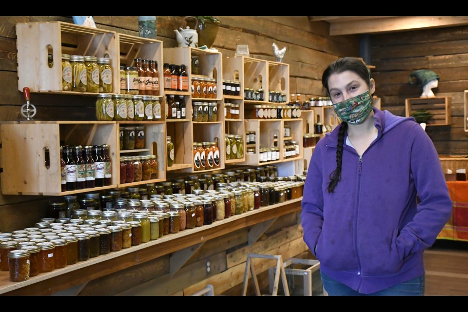 Nadine Lee with The Wandering Market next to the store’s wide range of preserves.