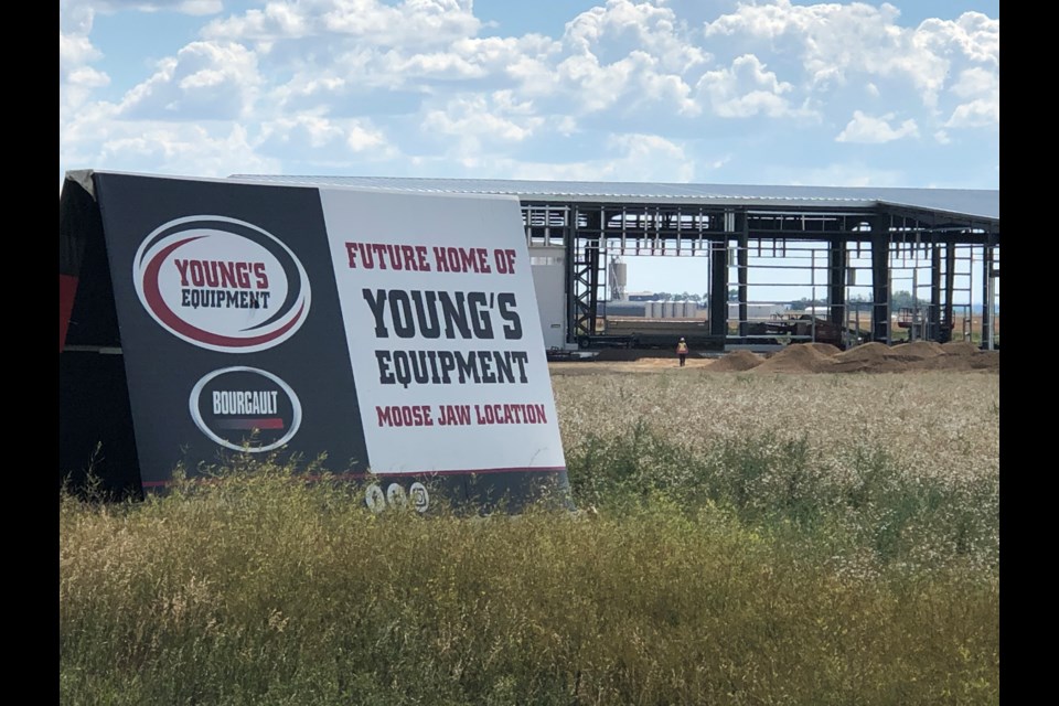 A sign adjacent to Highway 1 West indicates that the building in the background will be the new home of Young's Equipment in Moose Jaw. Photo by Jason G. Antonio 