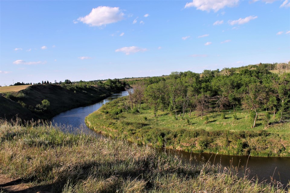 The camp is believed to have been located at this curve in the river, although there would have been more brush and less trees in the 1880s.