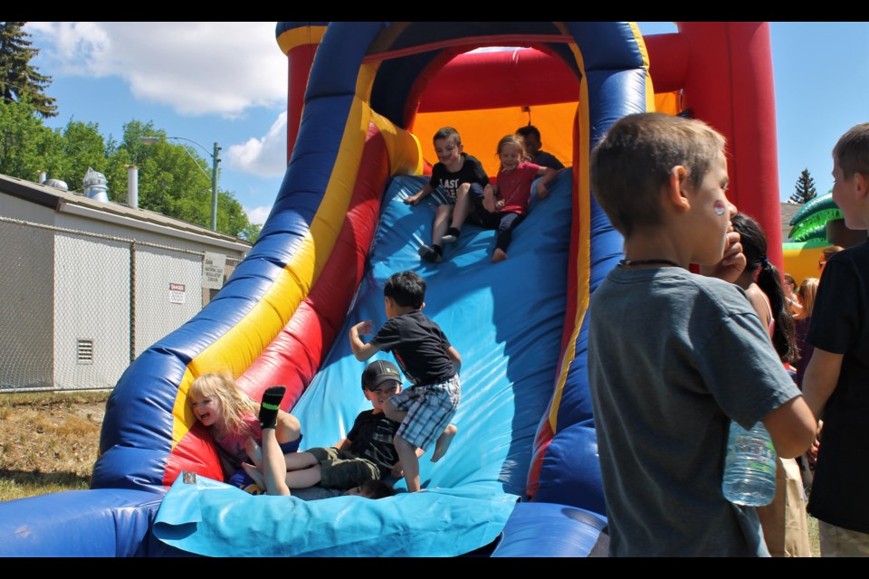 There were two bouncy castles set up, both bouncing with excitement.