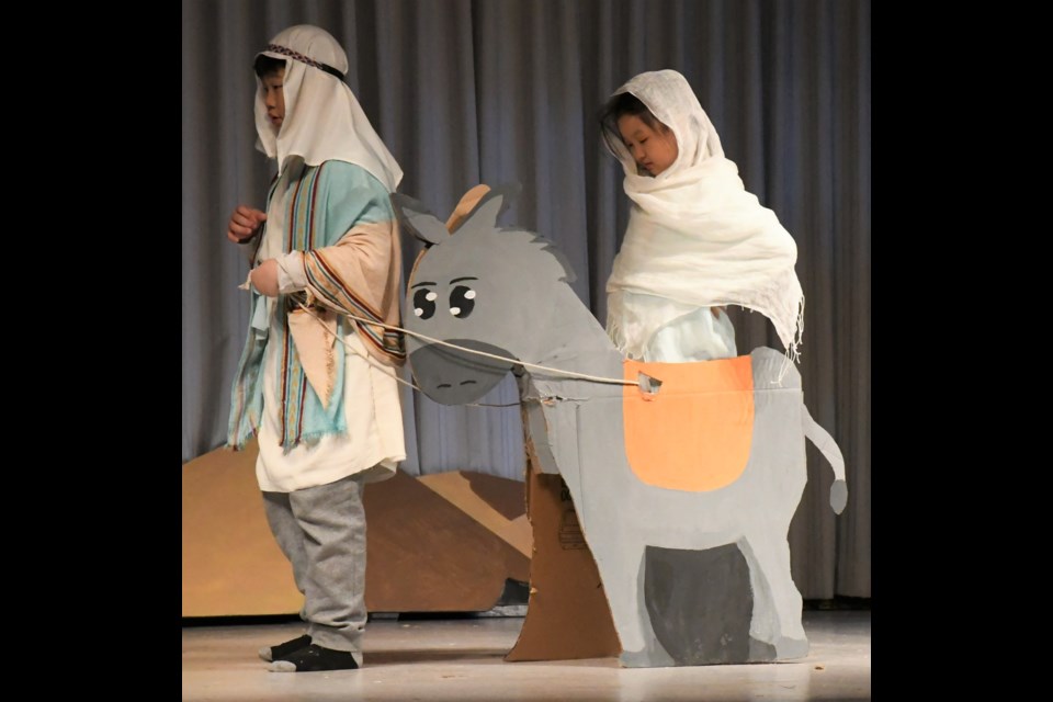 Joseph leads a pregnant Mary toward an Inn in Bethlehem. Photo by Jason G. Antonio