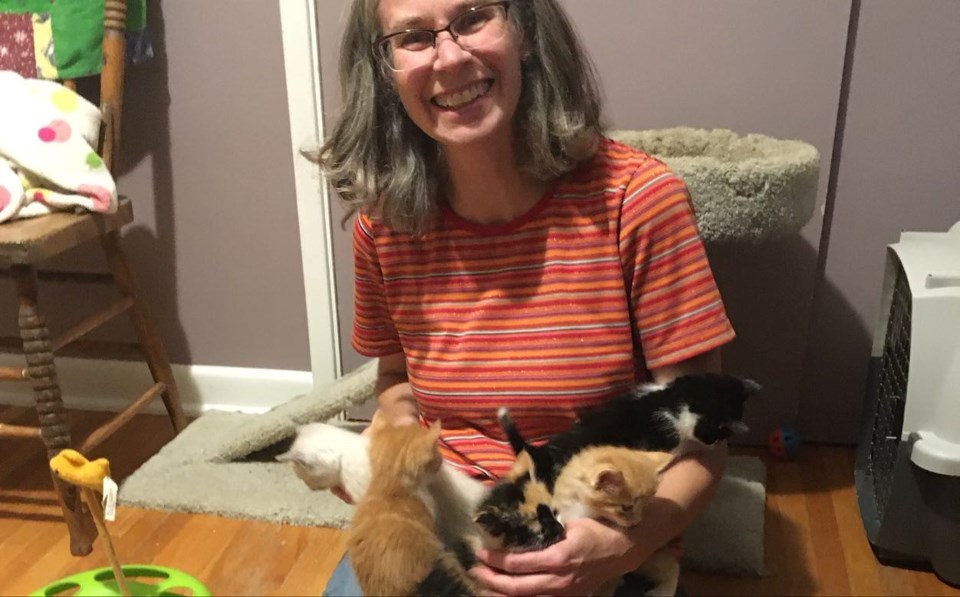 Jennifer Tenford with a litter of orphan kittens