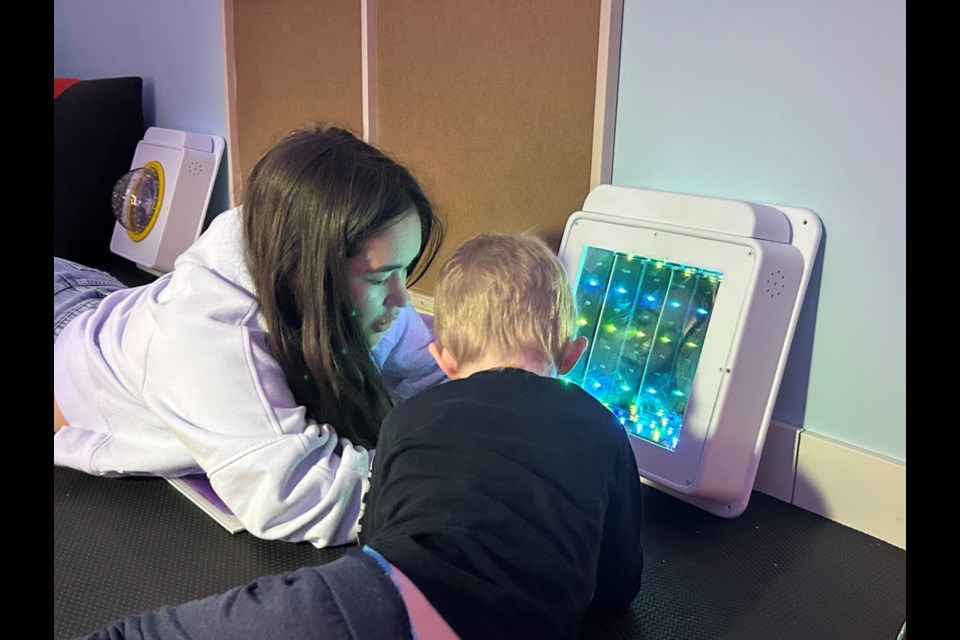 Jaycee Adams in sensory room with Timothy Eastman