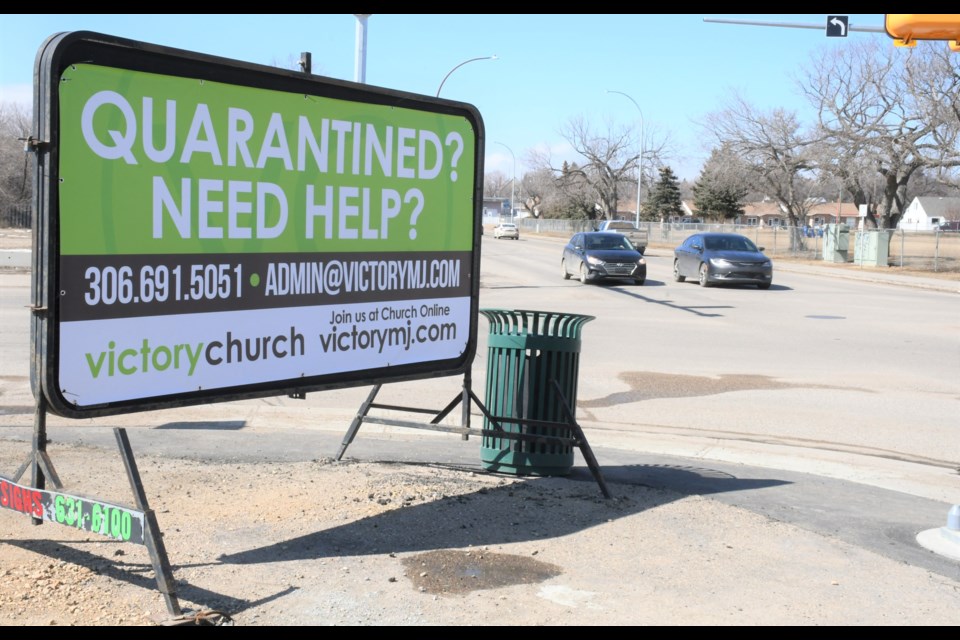 A sign at the corner of First Avenue Northwest and Caribou Street indicates the type of support Victory Church is offering residents. Photo by Jason G. Antonio 