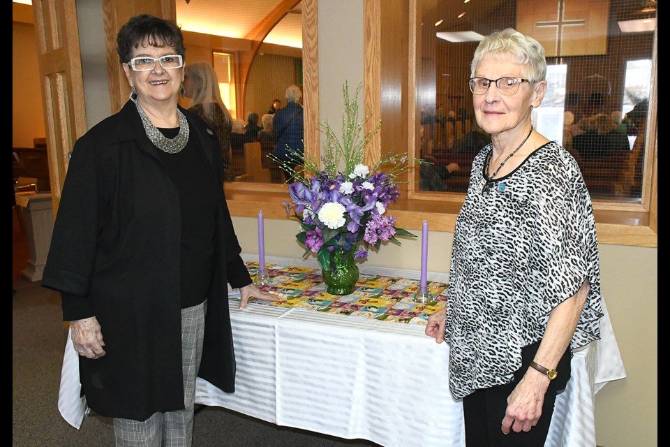 Jan Coward (left) and Vivian Wilson, co-organizers of this year's World Day of Prayer, gather before the start of the March 3 event at Minto United Church. Photo by Jason G. Antonio