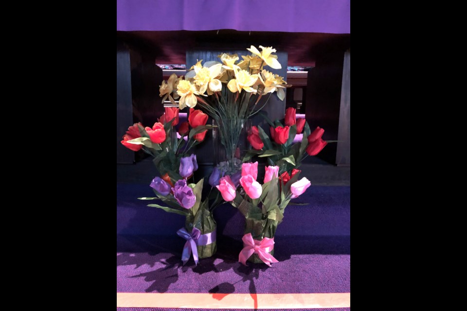 Flowers in front of the altar. Photo by Jason G. Antonio